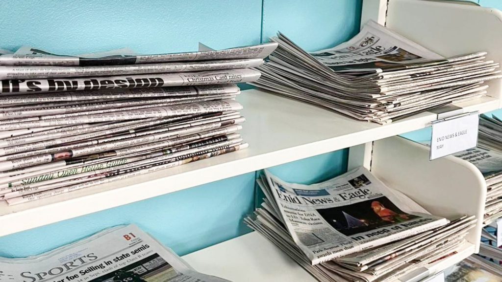 newspapers on shelf