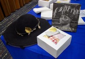 Church hats were worn while drinking tea and eating graze boxes during Enid Public Library’s Crown Tea event to discuss the book Crowns: Portraits of Black Women in Church Hats. 